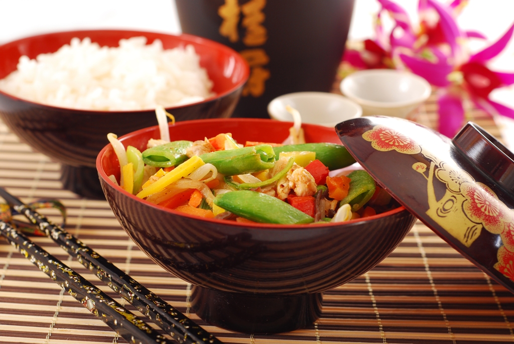 Rice and stir-fried vegetables in lacquer bowls at Sakura