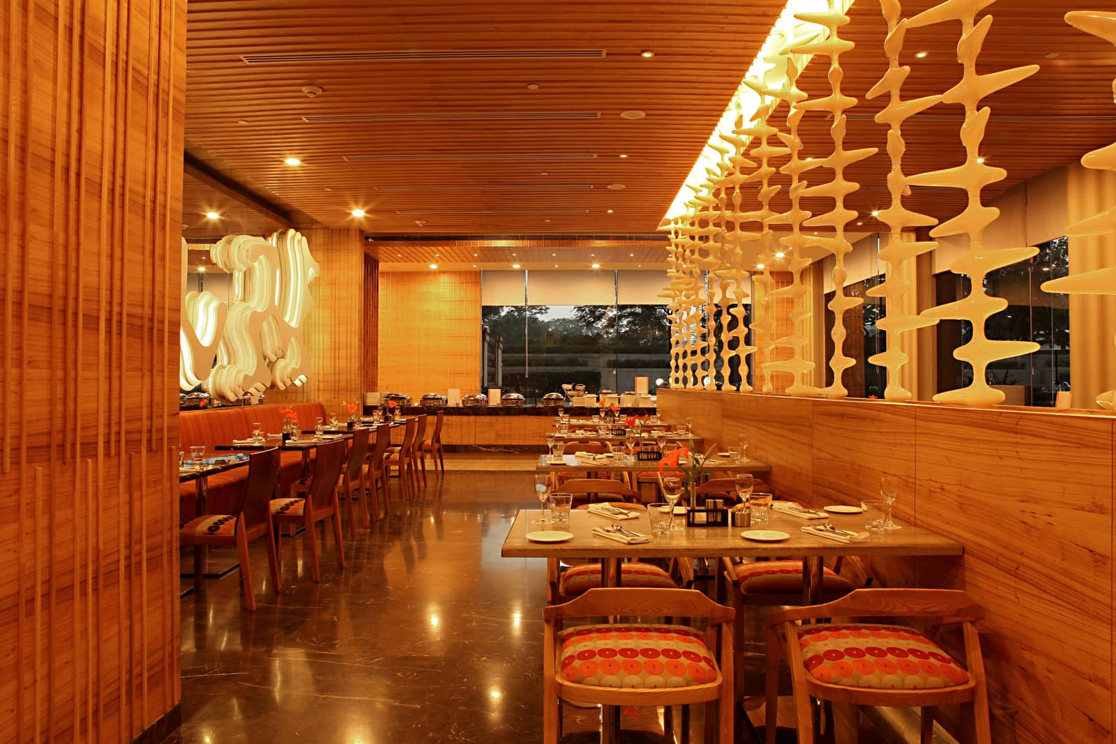 The long dining hall at Zing, with the counter down one side