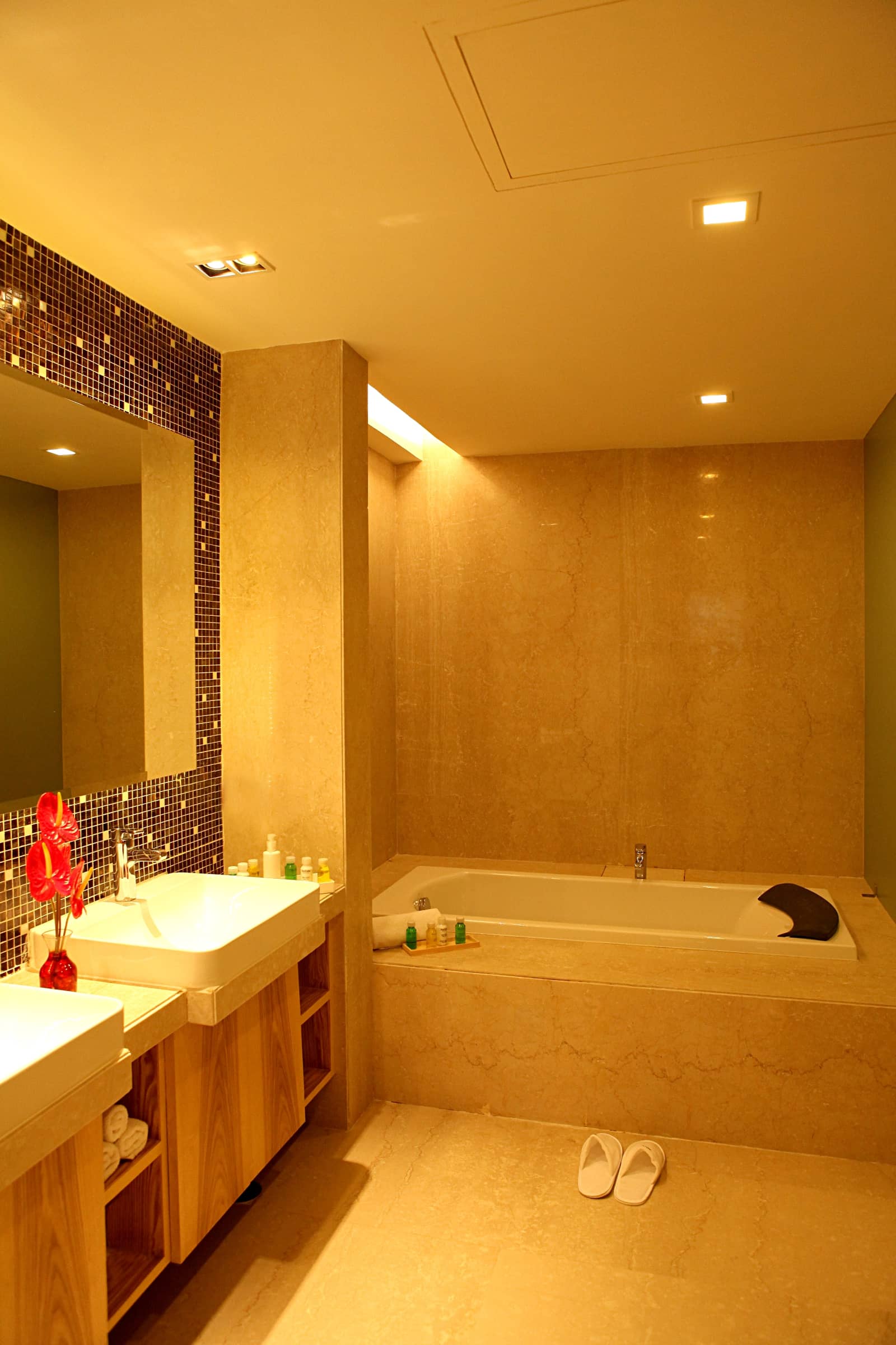 A marble bathroom with a tub