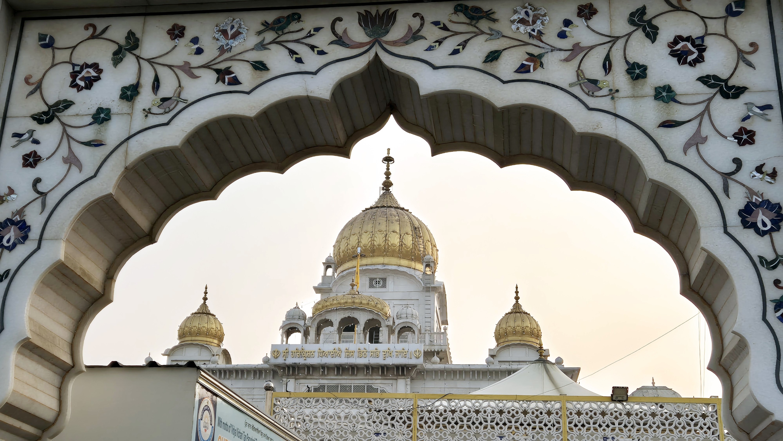 Gurudwara Bangla Sahib, its golden domes above the tank