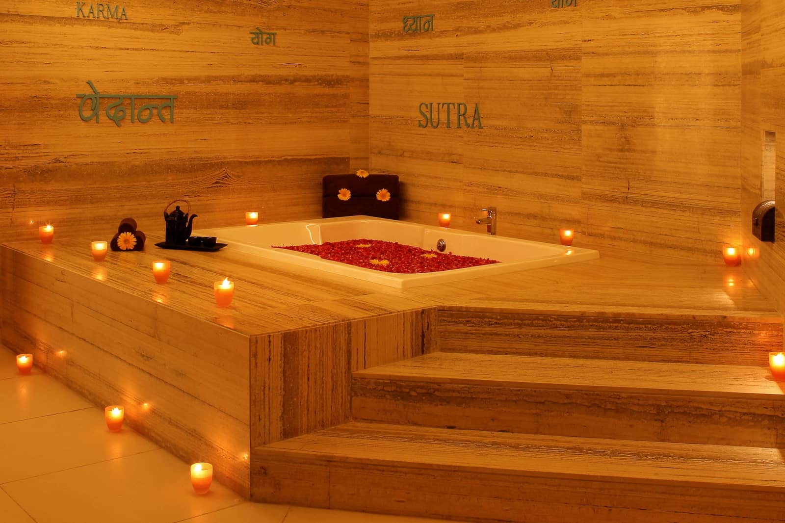 A petal bath drawn in a treatment suite at neoVeda Spa